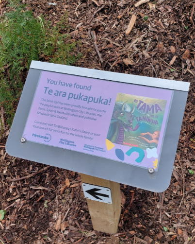 A welcome page is displayed on a post, with an arrow pointing in the direction of the walk. 